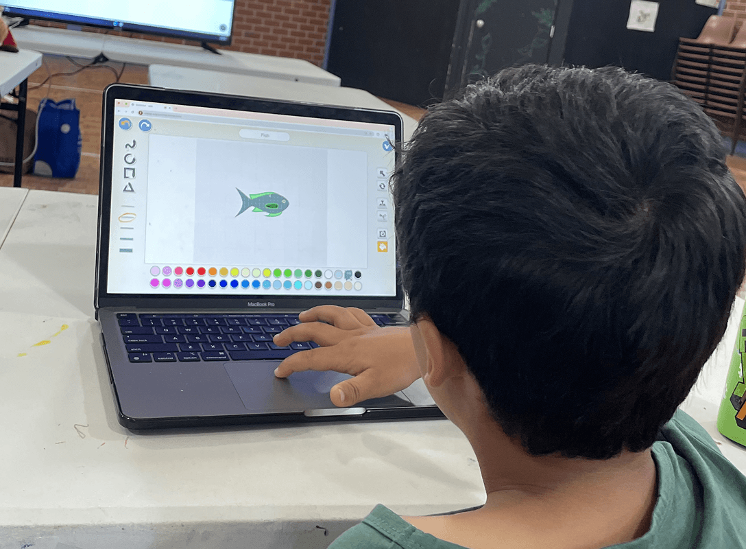 Student coding on laptop